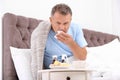 Man suffering from cough and cold in bed Royalty Free Stock Photo