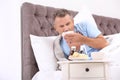 Man suffering from cough and cold in bed Royalty Free Stock Photo