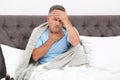 Man suffering from cough and headache in bed Royalty Free Stock Photo