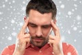 Man suffering from head ache or thinking over snow Royalty Free Stock Photo