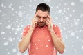 Man suffering from head ache or thinking over snow Royalty Free Stock Photo