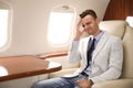 Man suffering from headache during flight Royalty Free Stock Photo