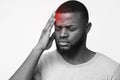 Man suffering from migraine, touching his forehead Royalty Free Stock Photo