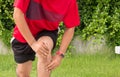 Man suffering from pain in leg,Knee injury after sport exercise running jogging and workout outdoor Royalty Free Stock Photo