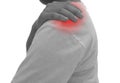 Man suffering from shoulder pain on white background , Healthc