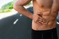 Man Suffering From Stomach Pain After Running Outdoors. Sport Injury Royalty Free Stock Photo