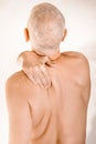 Man suffering of thoracic vertebrae or trapezius muscle pain