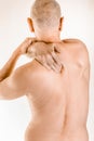 Man suffering of thoracic vertebrae or trapezius muscle pain