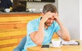 Man suffers headache. Deadline coming search ideas need inspiration. Man disappointed desperate face sit cafe with mug Royalty Free Stock Photo