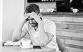 Man suffers headache. Deadline coming search ideas need inspiration. Man disappointed desperate face sit cafe with mug Royalty Free Stock Photo