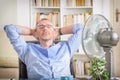 Man suffers from heat in the office or at home Royalty Free Stock Photo