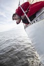 A man suffers from seasickness while walking on a yacht. Royalty Free Stock Photo