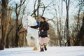 Man in suit of ancient warrior walking with the big white horse Royalty Free Stock Photo