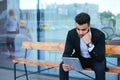 Man in suit arabic puts on sunglasses with tablet near business center Royalty Free Stock Photo