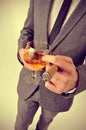 Man in suit with a cigar and a glass with brandy Royalty Free Stock Photo