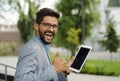 man in suit closeup portrait holding tablet thumbs up Royalty Free Stock Photo