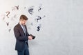 Man in suit with empty wallet, currency signs