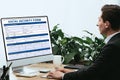 Man in suit filling in Social Security Form Royalty Free Stock Photo