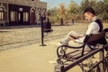 Man in suit with glasses and whiskers reading book in the old town Royalty Free Stock Photo