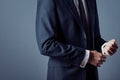 Man in suit on a grey background, hands closeup Royalty Free Stock Photo