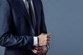 Man in suit on a grey background, hands closeup Royalty Free Stock Photo