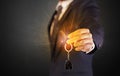 Man in suit hand over keys Royalty Free Stock Photo