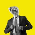 The man in a suit with a head in the form of a fist. Metaphor of an angry boss. Contemporary art collage Royalty Free Stock Photo