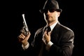 Man in suit holding a 357 magnum revolver. Royalty Free Stock Photo