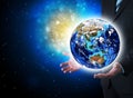 Man in suit holding a earth in hand Royalty Free Stock Photo