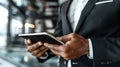 Man in Suit Holding Tablet Royalty Free Stock Photo