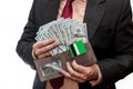 Man in suit holding wallet with dollar banknotes and credit card Royalty Free Stock Photo