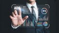 Man in suit interacting with holographic data display showing graphs and charts Royalty Free Stock Photo