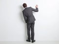 Man in Suit Leaning Against Wall