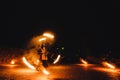 A man in a suit LED dances with fire night..fire show at a wedding and a lot of the bright sparks. dancing with flame, male