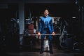 Man in suit lifting heavy weight Royalty Free Stock Photo