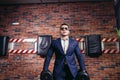 Man in suit lifting weight in gym Royalty Free Stock Photo