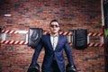 Man in suit lifting weight in gym Royalty Free Stock Photo