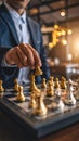 Man in suit makes chess move on the chess board with golden and silver chess pieces. Royalty Free Stock Photo