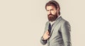 Man in suit. Male beard and mustache. Sexy male, brutal macho, hipster. Hand in with wrist watch in a business suit Royalty Free Stock Photo