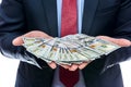 Man in suit offering dollar banknotes close up Royalty Free Stock Photo