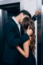 man in suit passionately kissing and Royalty Free Stock Photo