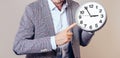 A man in a suit points to his watch Royalty Free Stock Photo