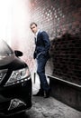 Man in suit posing near car Royalty Free Stock Photo