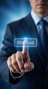 Man in Suit Pressing Start Up Button Blue Background Royalty Free Stock Photo