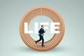 A man in a suit runs in a hamster wheel. The concept of liberation from slavery, life, business, manipulation, control Royalty Free Stock Photo