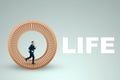 A man in a suit runs in a hamster wheel. The concept of liberation from slavery, life, business, manipulation, control Royalty Free Stock Photo