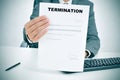 Man in suit showing a figured signed termination document Royalty Free Stock Photo