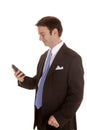 Man in suit side look at phone Royalty Free Stock Photo