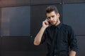 Serious male phoning via cellphone Royalty Free Stock Photo