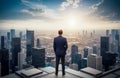 man in suit standing on rooftop, looking out over city. He is alone and seems to be lost in thought. successful businessman in Royalty Free Stock Photo